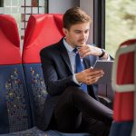 Outsourcing Travel Bookings Give Your Firm The Edge Man on train